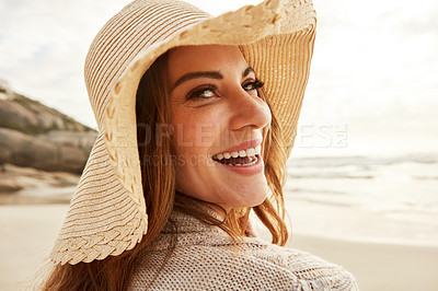 Buy stock photo Portrait of a young woman spending some time at the beach
