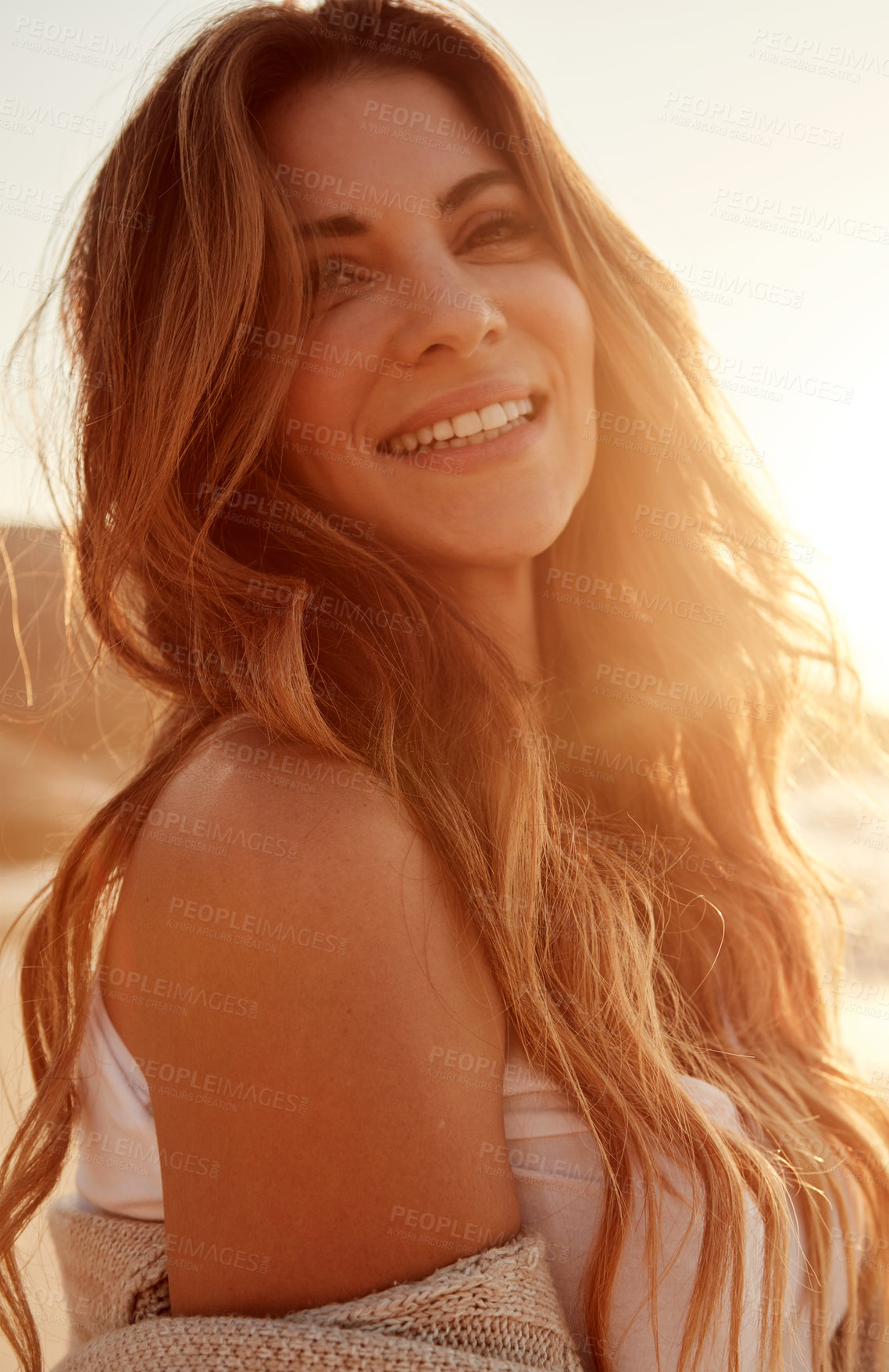 Buy stock photo Portrait of a young woman spending some time at the beach