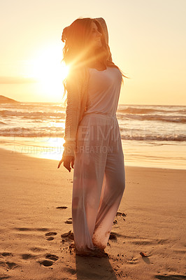 Buy stock photo Shot of a young woman spending some time at the beach