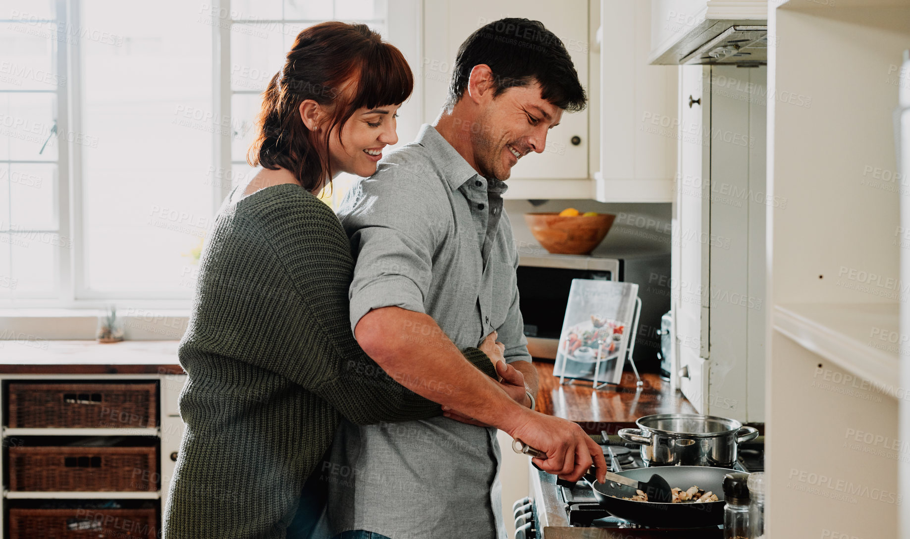 Buy stock photo Cooking, man and woman together for hug in kitchen for support, commitment and trust in relationship. Happy couple, love and smile while preparing meal for breakfast, date and healthy eating at home