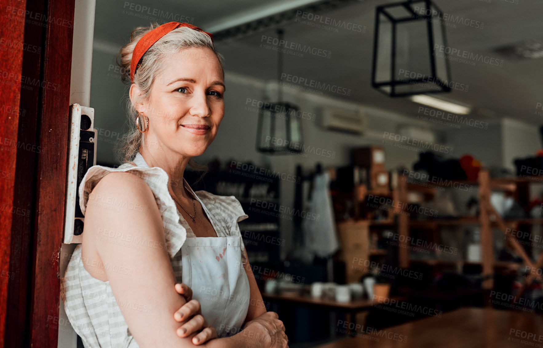 Buy stock photo Happy woman, portrait and arms crossed by entrance in small business confidence for workshop in retail store. Confident female person, ceramic designer or owner smiling for craft or creative startup