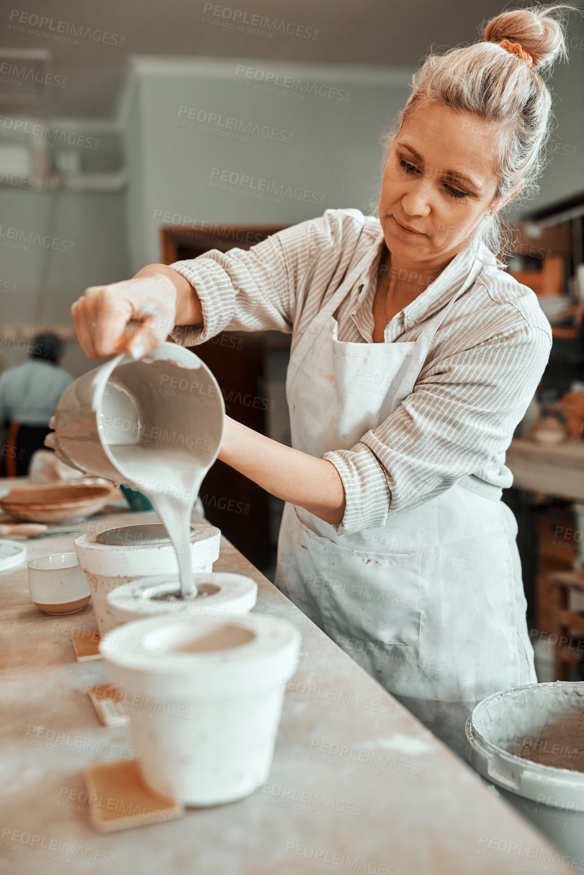 Buy stock photo Art, pouring and woman in pottery studio with clay for design, industry or small business startup. Creative, production and process with professional person in ceramics workshop for retail or trade