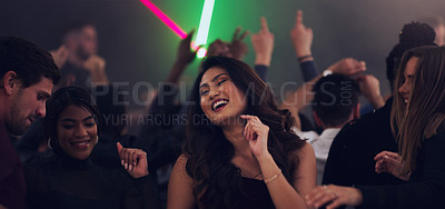 Buy stock photo Cropped shot of an attractive young woman dancing in a nightclub