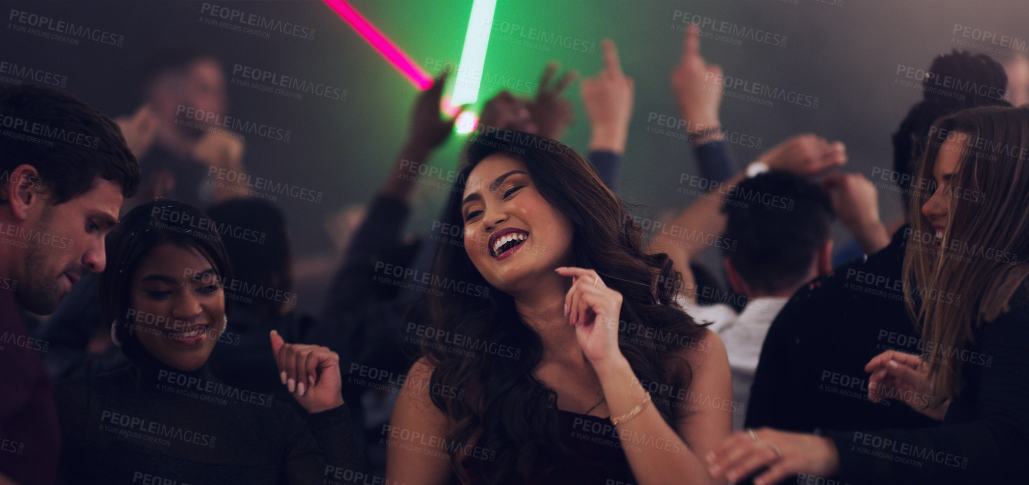 Buy stock photo Cropped shot of an attractive young woman dancing in a nightclub