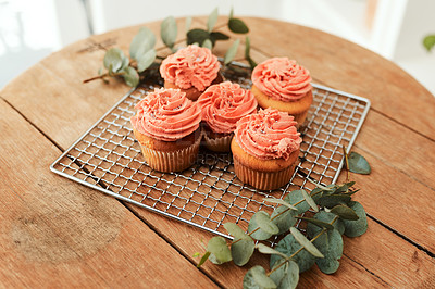 Buy stock photo Cropped shot of neatly arranged and freshly baked cupcakes on a metal tray for a blog post