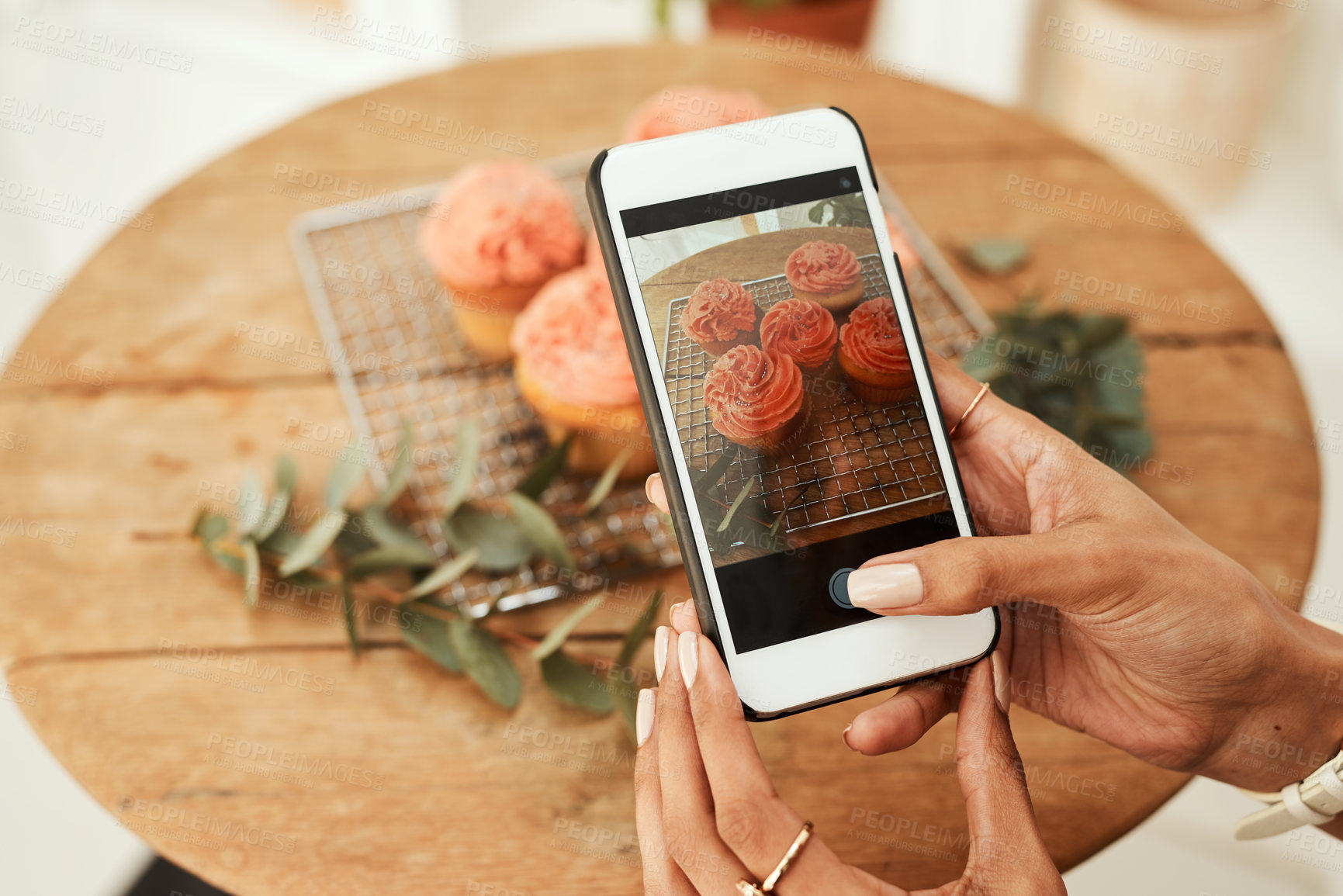 Buy stock photo Hands, woman and phone with food photography for social media post, dessert blog and influencer of baking podcast. Person, mobile and photographer with cupcakes, content creator and breakfast cafe