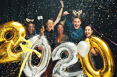 Buy stock photo New year, celebration and friends with balloons at party, confetti event and social on dark black background in studio. Happy, smile and diversity to celebrate holiday with portrait of men and women