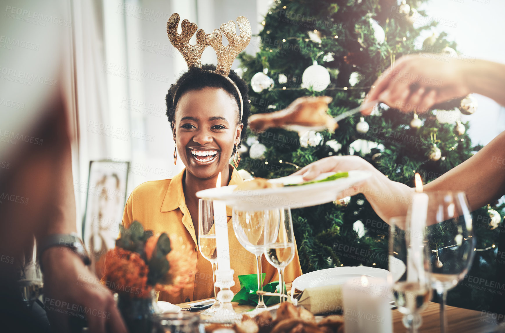 Buy stock photo Christmas, food and happy with woman at dining table for festive celebration, decoration or winter holiday. Social, merry season and xmas eve with friends at home for support, vacation or tradition