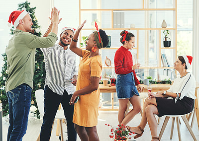 Buy stock photo Christmas, party and high five with business people having fun in their office together during the festive season. Team, motivation and celebration with a man and woman colleague group at work