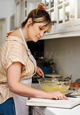 Buy stock photo Baking, book and recipe with woman in kitchen of home for guide, instructions or reading steps. Cooking, food and small business bakery with entrepreneur chef at counter of apartment for startup