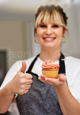Buy stock photo Woman, smile and cupcake with thumbs up in bakery for happiness, agreement and success of small business. Female baker, yes emoji and sweet dessert for food industry with chef and promote startup