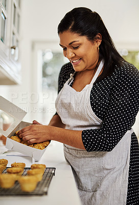 Buy stock photo Cropped shot of a baker packing freshly baked pies into boxes