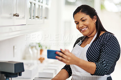 Buy stock photo Cropped shot of a woman taking a selfie in her kitchen