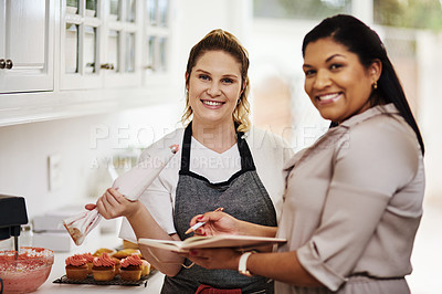 Buy stock photo Cropped shot of two entrepreneurs starting their own bakery