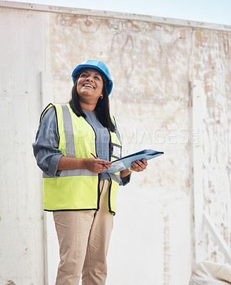 Buy stock photo Cropped shot of an attractive young female construction worker working on site
