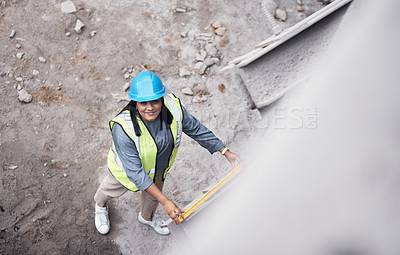 Buy stock photo Woman, smile or portrait with level at construction site for property, architecture or above at building. Engineer, technician and happy with helmet for inspection, measure or real estate development