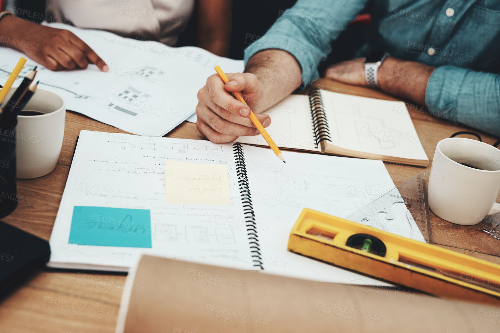 Buy stock photo Cropped shot of two unrecognizable architects working together in a modern office