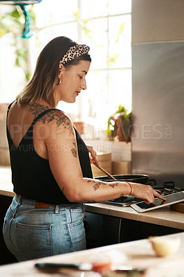 Buy stock photo Girl, reading or tablet in kitchen for cooking, recipe tutorial or streaming lesson online. Woman, meal prep or tech in home for food blog website, nutritional guide app or lunch idea on social media