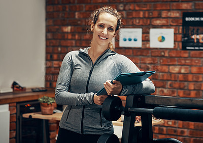 Buy stock photo Cropped shot of a fitness instructor holding a clipboard