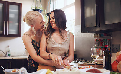 Buy stock photo Lesbian couple, cooking and helping in kitchen for a party celebration at home for new years, Christmas or birthday with food and wine. Gay women making food for dinner or lunch to celebrate holiday
