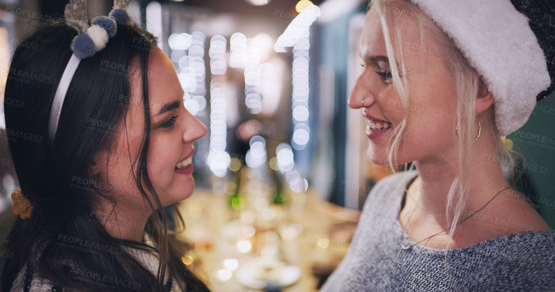 Buy stock photo Woman, lesbian and smile at Christmas party for festive celebration or funny joke, connection or gathering. Female people, couple and lgbtq pride for queer relationship at  holiday, house or love