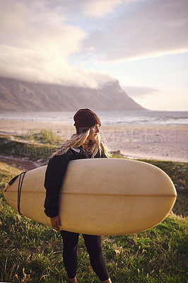 Buy stock photo Shot of an attractive young woman out surfing in the wilderness