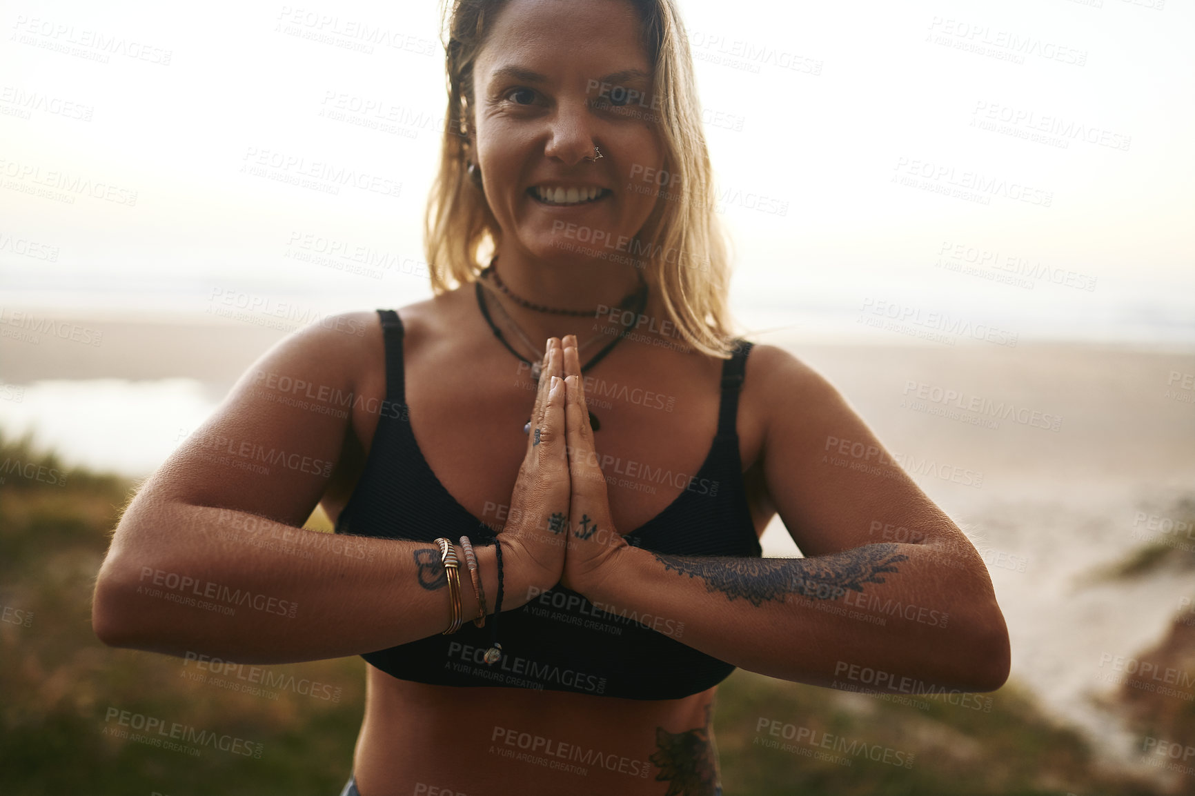 Buy stock photo Beach, portrait and woman with namaste for meditate, wellness and inner peace for mindfulness. Nature, female person and yogi with prayer hands for yoga, mental health and smile for holistic energy