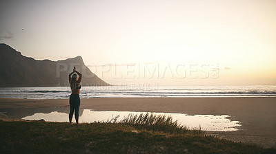 Buy stock photo Full length shot of an unrecognizable woman standing alone and meditating during a relaxing day outdoors