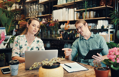 Buy stock photo Small business, people and laptop at plants for brainstorming, budget review and teamwork in boutique. Man, woman and technology at table for marketing strategy, information and customer feedback