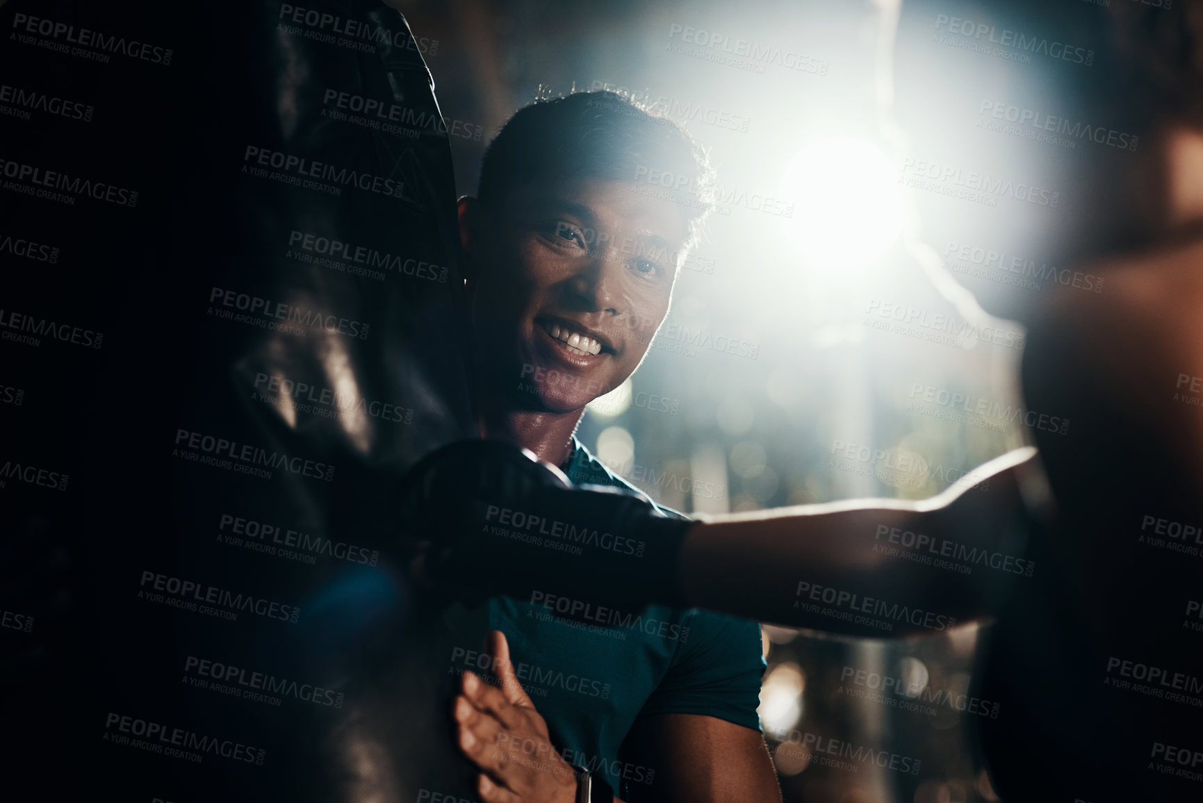 Buy stock photo Cropped shot of a handsome young male fitness instructor coaching a female boxer in a gym