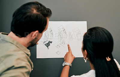 Buy stock photo Man, woman and reading blueprint at architecture agency for decision, point or review by wall at startup. People, partnership and engineering for feedback, design and floor plan on document in office