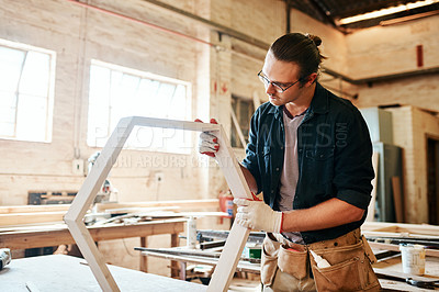 Buy stock photo Workshop, man and carpentry with furniture as handyman for woodwork, supply chain and manufacturing. Male person, small business and serious as employee with tools, equipment or material for crafting