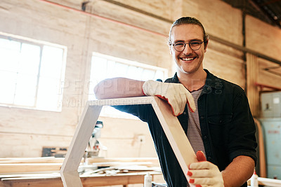 Buy stock photo Portrait, smile and carpenter with wood, man and manufacturing of furniture, creative and industry. Small business, entrepreneur and person with material, handyman and gloves for safety in Germany