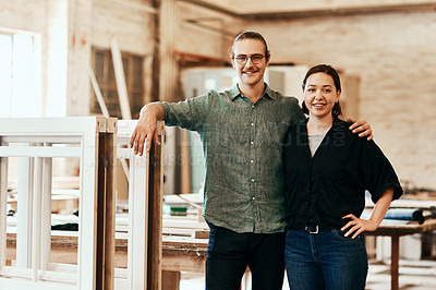 Buy stock photo Portrait of two young carpenters at work in their workshop