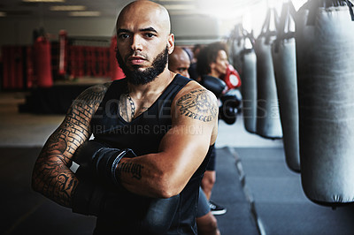 Buy stock photo Shot of a male boxer training at the gym