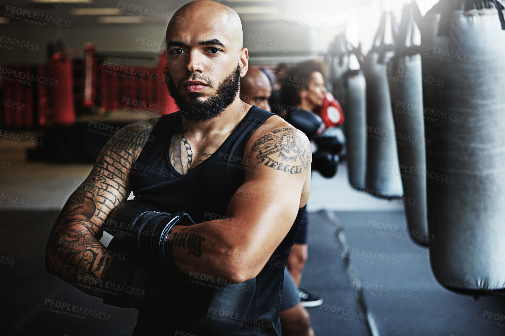 Buy stock photo Shot of a male boxer training at the gym