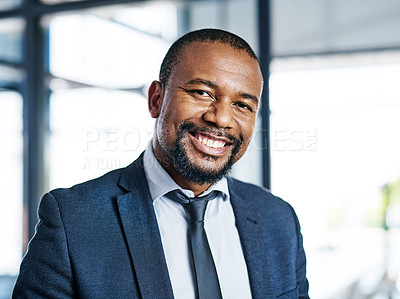 Buy stock photo Cropped portrait of a handsome middle aged businessman smiling while standing in a modern office
