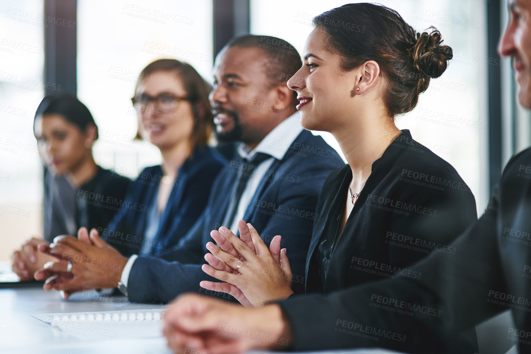 Buy stock photo Cropped shot of a diverse group of young businesspeople attending a conference