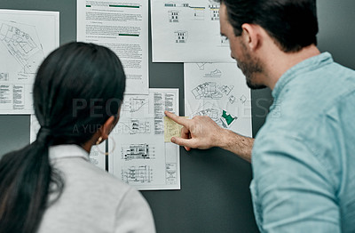 Buy stock photo Blueprint, man and woman at board for architecture, project management or creative development from back. Planning, office and design team at moodboard for civil engineering, brainstorming or ideas