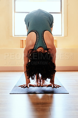 Buy stock photo Shot of a young woman practicing yoga