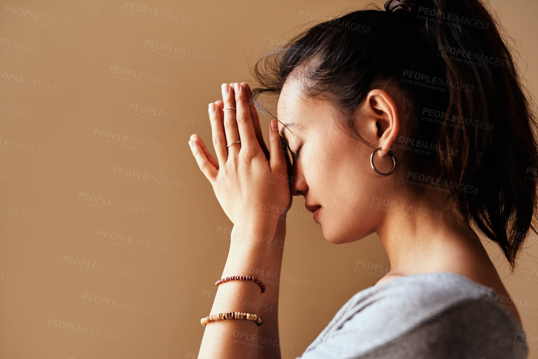 Buy stock photo Studio, meditate and woman with namaste for wellness, inner peace and mindfulness with zen aura. Mockup space, female yogi and yoga with prayer hands for mental health, chakra and isolated background