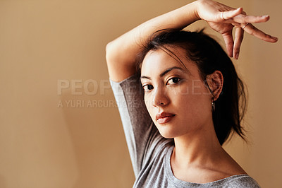 Buy stock photo Portrait of a young woman making a hand gesture during a yoga session