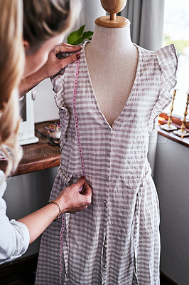Buy stock photo Fashion, designer with mannequin and measuring tape, woman working at creative small business boutique. Focus, creativity and tailor with dress design on doll for clothes in studio or textile startup