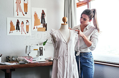 Buy stock photo Fashion, design and woman with mannequin, measuring tape and sewing machine at creative small business. Focus, creativity and tailor with dress on doll for clothes, designer in textile startup studio