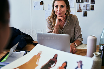 Buy stock photo Cropped shot of a fashion designer sitting at her desk