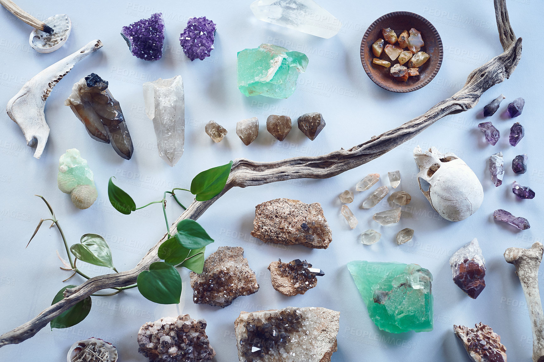 Buy stock photo Crystal, nature and skull with stones on a white background for holistic, spiritual and occult ritual. Reiki, mystical and gems, natural minerals and quartz rocks for healing, cleanse and health