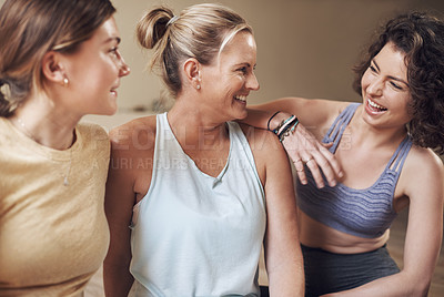 Buy stock photo Cropped shot of a young group of women sitting together and bonding during an indoor yoga session