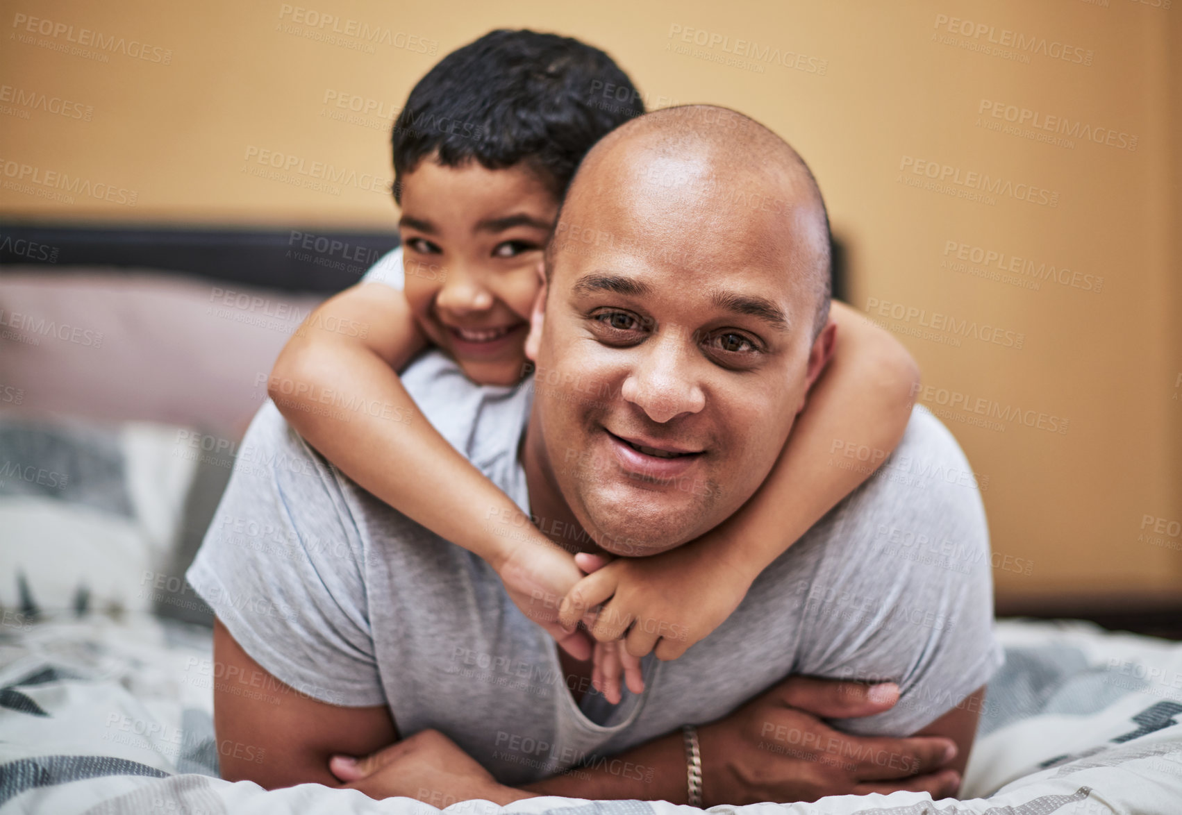 Buy stock photo Father, son and portrait with love in bedroom for bonding with people, home and family for happiness. Parent, caring and trust with role model in house for nurturing with positive childhood in London