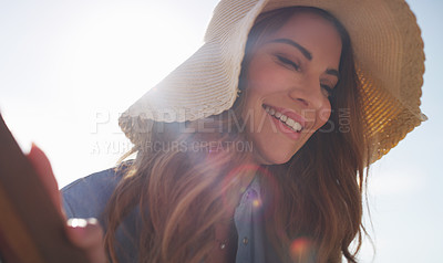 Buy stock photo Cropped shot of an attractive young woman enjoying the beach on a summer's day
