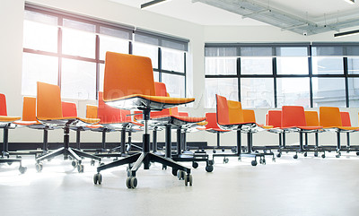 Buy stock photo Shot of chairs in an an empty modern office